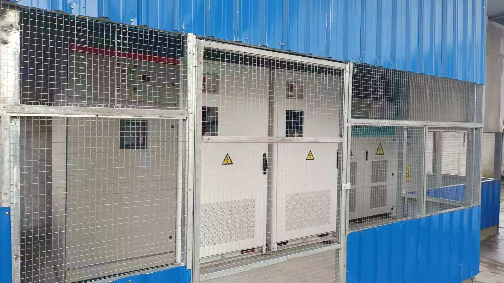 Two Galaxy 261L all-in-one BESS cabinets (250kW/522kWh) installed in a protected enclosure for factory microgrid stabilization in Myanmar